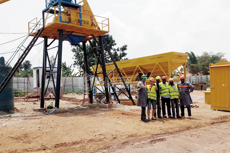  HAMAC technician with local workers in Rwanda