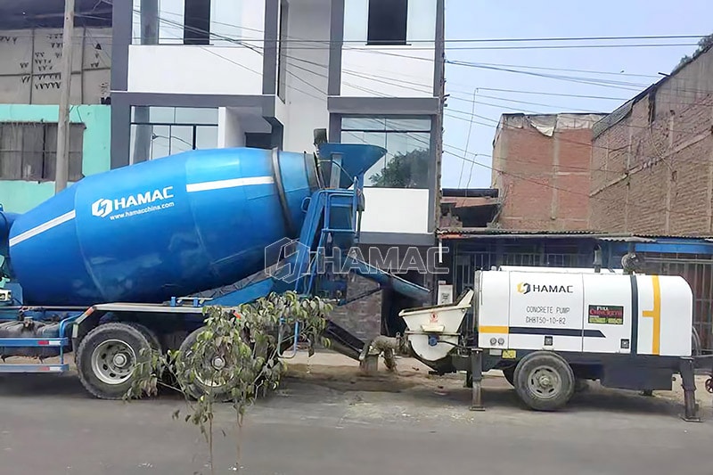 Concrete mixer truck works together concrete pump
